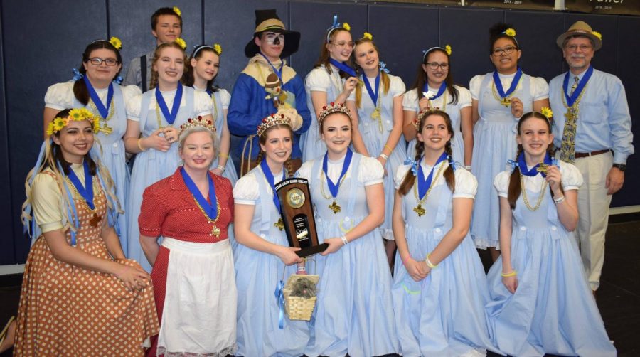 The guard poses after they had finished their show and placed first for their competition, with the highest score in the state. “I knew we were going to do well,” director Jeff Rudy said. “I thought we had a really good chance of winning, but there is never any guarantee.”
