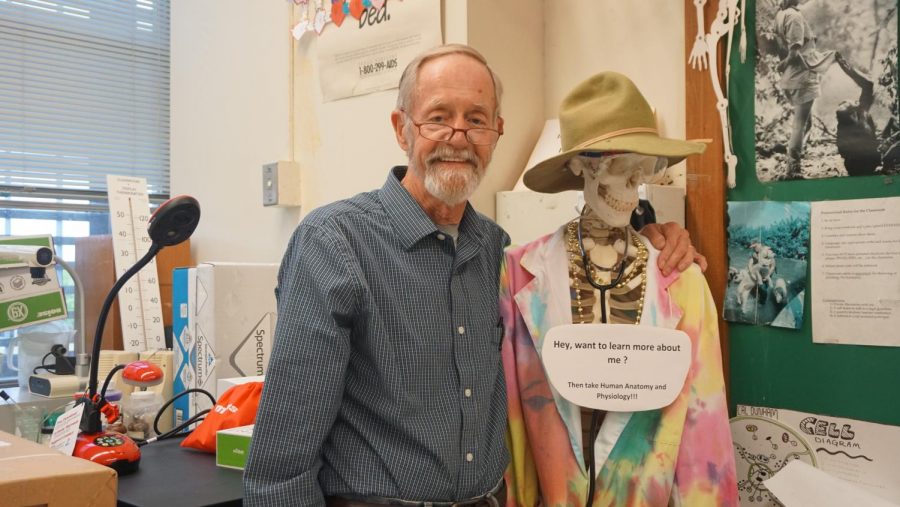 Richard Whisennand poses with his model skeleton, Lucy. Photo by Bella Russo.