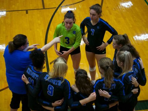 Head coach Amy Brodbeck instructs her team during a break in the action against arch-rival Anderson.  The Knights played the Trojans tough, but lost in two tightly contested sets, 25-23, 25-23.