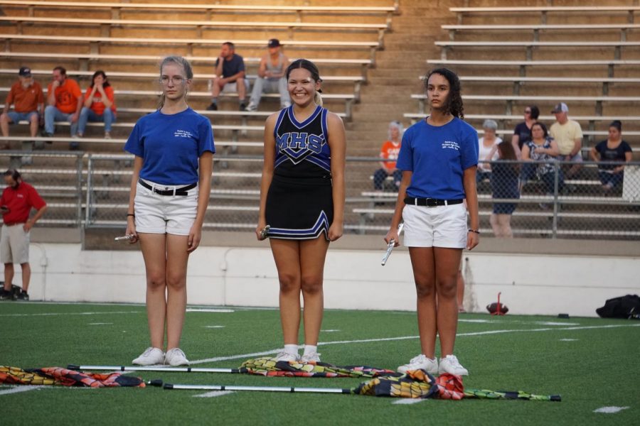 As her fellow flute players Taelisen Hutson and Claire De Silva-Yost look ahead with intent focus, Crist giggles up a storm out on the field during the marching show. She told us that in this moment, the cheerleading team was yelling especially loud for her and making funny faces from the sideline, making it impossible for her to keep a straight face. Hutson stated that she really enjoys having Crist as a part of her section in band. “Having (Crist) on the field makes each performance so much better because her energy boosts everyone else’s,” Hutson said. “It must be hard trying to balance both band and cheer, but cheering her on is one of the best parts about football games.”