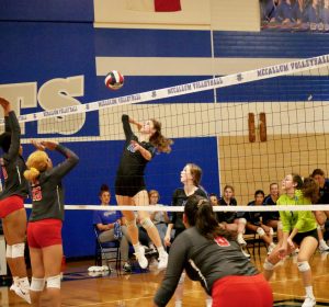 Junior outside hitter Sarah Weisbrodt leaps up for a kill against Travis on Friday, Sept. 27. After defeating the Rebels, the Knights have a 5-0 conference winning record, as does Dripping Springs, their opponent for Tuesday nights match.
