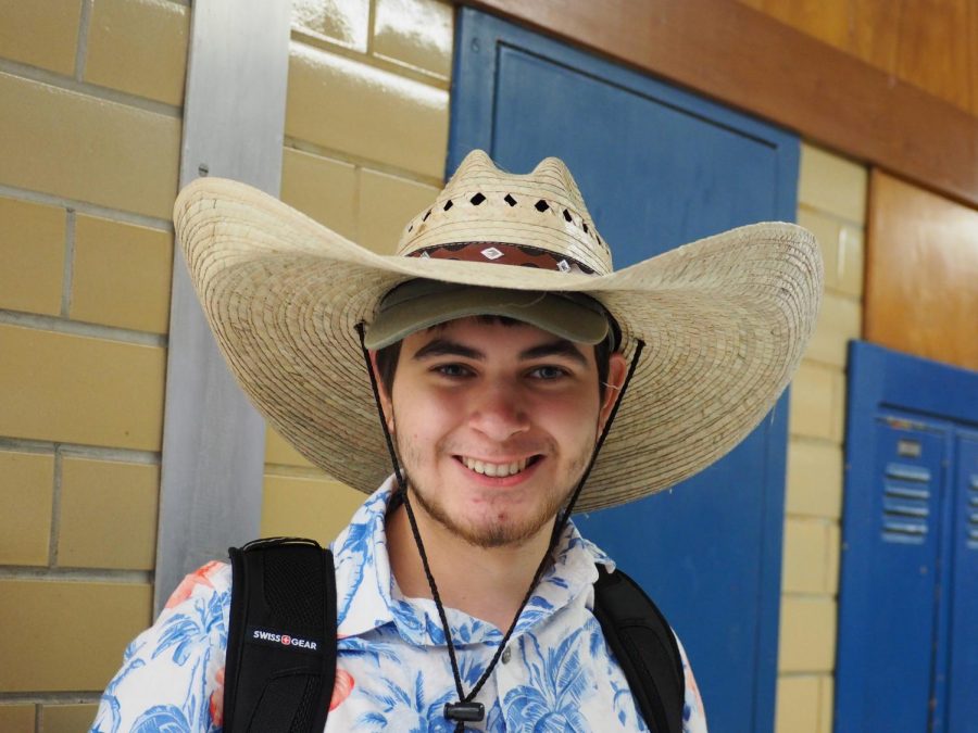 Sophomore Matthew Wilson poses for a photo on Crazy Hat Day. The new AISD dress code now allows students to wear hats every day. 