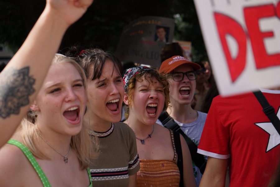 HEAR+OUR+CRY%3A+Standing+before+the+capitol%2C+McCallum+students+Ruby+Henson%2C+Abby+Green%2C+Louisa+Najar+and+Sabri+Armani+participate+in+the+rally+cries+at+the+Austin+Climate+Strike.+%E2%80%9CThis+is+our+climate%3B+we+are+the+change%2C%E2%80%9D+Najar+said%2C+who+added+that+she+believes+that+our+planet+and+the+climate+crisis+is+a+cause+that+unifies+people+all+over+the+world.+%E2%80%9CGlobal+climate+change+is+universal.+It+affects+all+people.+%5BIt+affects+them%5D+at+different+levels%2C+but+it+affects+everyone%2C+no+matter+what.%E2%80%9D+Photo+and+reporting+by+Samantha+Powers.