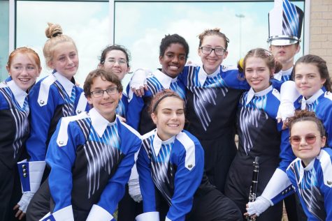 BAND BACKSTAGE: Members of the MAC clarinet section smile and pose pre-show, enjoying their last few moments before the all-day competitioin at Toney Burger Stadium kicks off.  A day full of of music, marching, and. although they didn’t know it yet, victory, lay ahead of them.