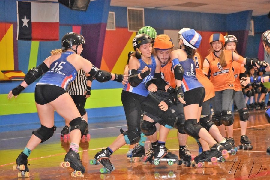Henson (left) and Stauffer (center) team up during the Texas Junior Roller Derbys victory over Rolling Rebellion Roller Derby on May 5 at Skate Country in Bellemead, Texas. The victory helped TXJRD to a 14th place finish nationally last season. The team is playing a non-competitive season this fall.