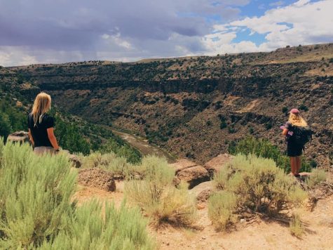 SCENIC SERENITY: Zach Steiner, right, and his Lama Foundation colleague Aaron (left) overlook the Rio Grande hot springs, which is located a short drive away from the foundation in Taos, New Mexico. Photo courtesy of Steiner. 