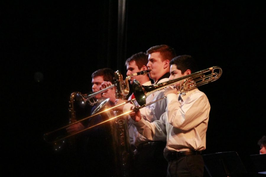 SPRING FLING: On Wednesday night in the MAC, four of the McCallum bands, the wind ensemble, the symphonic band, the concert band and the jazz band performed in the spring concert. The spring concert was also the last concert for the senior band members, and awards were given out to outstanding band students. The Louis Armstrong Award (given for outstanding jazz performance) was awarded to senior Dan Thomas. Senior Henry Stanford won the John Phillip Sousa Award, and the Outstanding Musician Award was given to senior Jon Forbes. Honors were also given to UIL State Band members senior Chance Green, junior Clifton Pike and sophomore Jacob Martinez. Photo by Scarlett Houser.