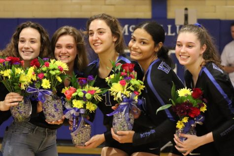 Fannin (fourth from left) and her senior teammates receive flowers at the Senior Night game against Dripping Springs. Photo by Gabby Sherwood.