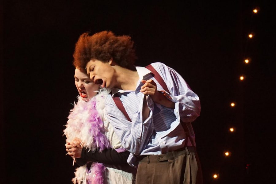 THEIR OWN TWIST: Performing a featured duet, Sophomore Abigail Lehman and Senior Zion Flores sing with a dramatic glance down, a reference to the lyrics in their song. The two joined forces with to create their own choreography and twist on the piece. “I really loved the collaboration of this song,” Lehman stated. “Getting to work with Zion is so much fun, and to get the song and make it our own was a great experience.” Photo and caption by Madelynn Niles.