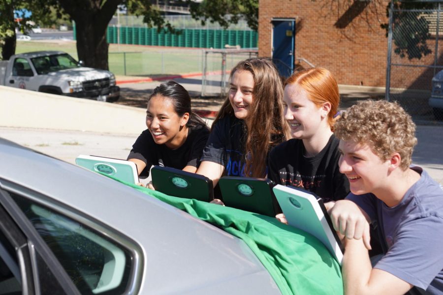 AP PHYSICS, A WEIGHTY SUBJECT: Juniors Hannah Zuniga, Lindsey Plotkin, Darian Dieterich and Tres Tanner complete a hands-on lab, in which the task was to use the skills they’d learned in trigonometry to solve for the mass of the car. “The lab was really interesting,” Tanner said. “Physics is a fun class; I will be taking the AP test.” Photo by Bella Kisler.