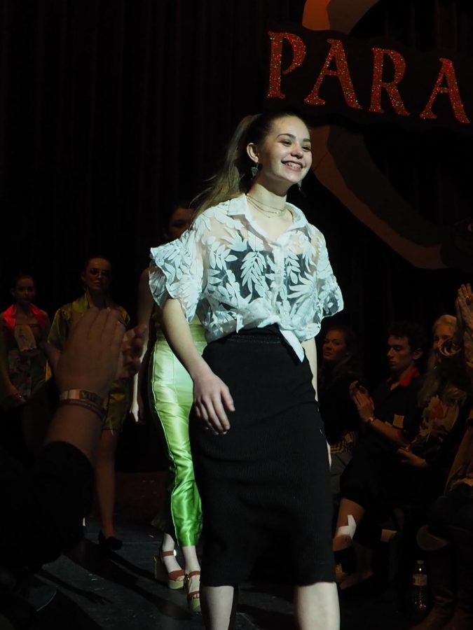 GRAND OL’ TIME: As a sophomore designer, Heinley presents her line,  the Grand Dame, to an applauding audience at Paradigm, the 2019 Benefit Fashion Show, in the MAC on Jan. 12. Her line won second place. “It was called the Grand Dame because it was about this idea of excessive extravagance,” Heinley said. “She’s just kickass and doesn’t care what anybody thinks: ‘I’m going to wear whatever I want all the time.’” Photo by Gregory James. 