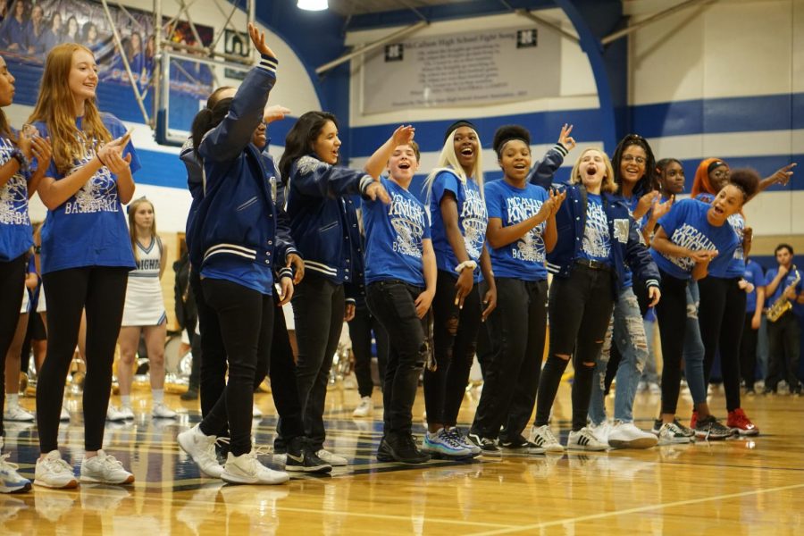 Varsity girls basketball team captain Alicia Scott draws the applause of the crowd and her teammates as she is introduced at the Battle of the Bell pep rally on Nov. 7.  