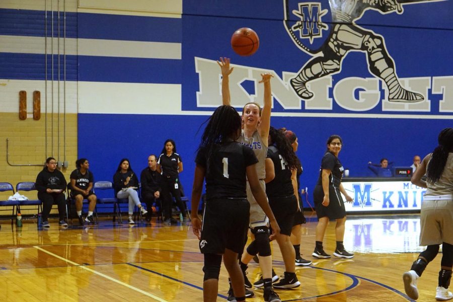 ABOVE: Harrington makes an entry pass during the Lady Knights’ victory over the Eastside Memorial Lady Panthers. Photo by Camille Wilson.