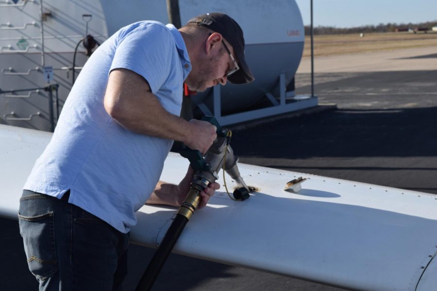 Pilot John Blossom-Boyd fuels for the first half of his journey. Altogether, the fuel comes out to around $100, but Blossom-Boyd doesn’t mind. “Flying is important to me because it embodies freedom in its purest form,” he said. “Not even gravity can hold you.” Photo by Anna Nagle.