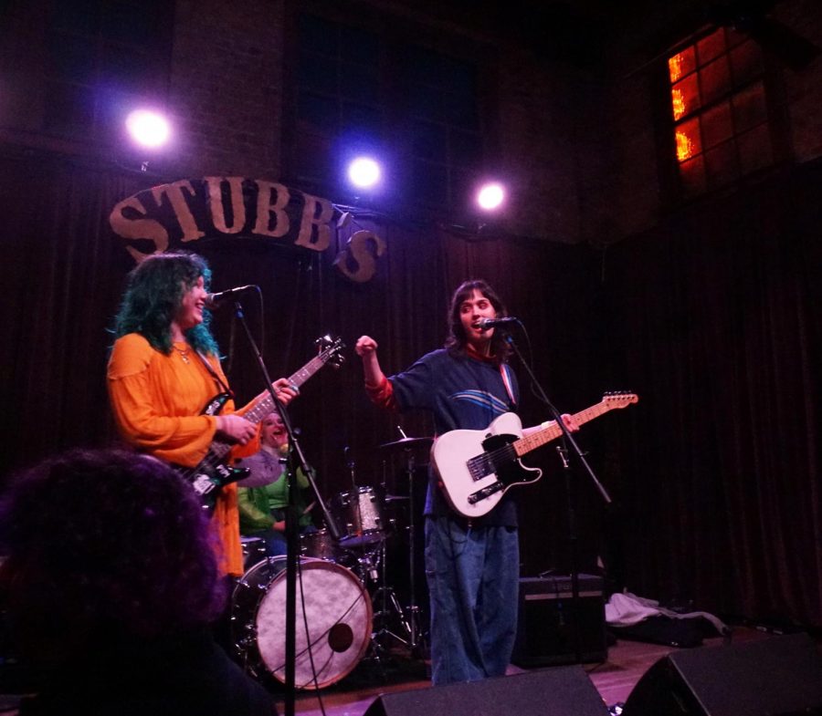 DYNAMIC DUO: Seniors Louisa Najar and Abby Green perform at Stubb’s Bar-B-Q on Tuesday, Feb. 11. The two girls, along with senior Ruby Henson, are the members of a band they named Pit Punch. “We started to talk about making music during the summer of 2019,” Green said. “When we write songs, inspiration comes from the mood we are in and the vibe of the day." Photo by Lily Wilson.