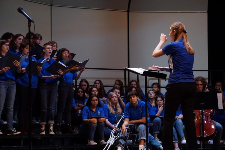 DIRECTOR AND NOW MOTHER: Allison Kashdan conducts the varsity choir at the McCallum Choir concert that took place on Oct. 3. That concert was the only one Kashdan conducted before taking her maternity leave to have her daughter, Acadia Kashdan. Kashdan passed the torch to Malcolm Nelson, who conducted the pre-UIL concert weeks before the quarantine shut down the actual UIL competition. Although the choir students are enjoying learning from Nelson, they await reuniting with their director. Sophomore Charlotte Bearse, a varsity choir member, admires Kashdan for the way she treats her students. “She’s such a sweet human being and I love how kind she is to all of her students and I love how she treats everyone,” Bearse said. “I feel like I can respect her and go to her with things.” Photo by Annabel Winter.