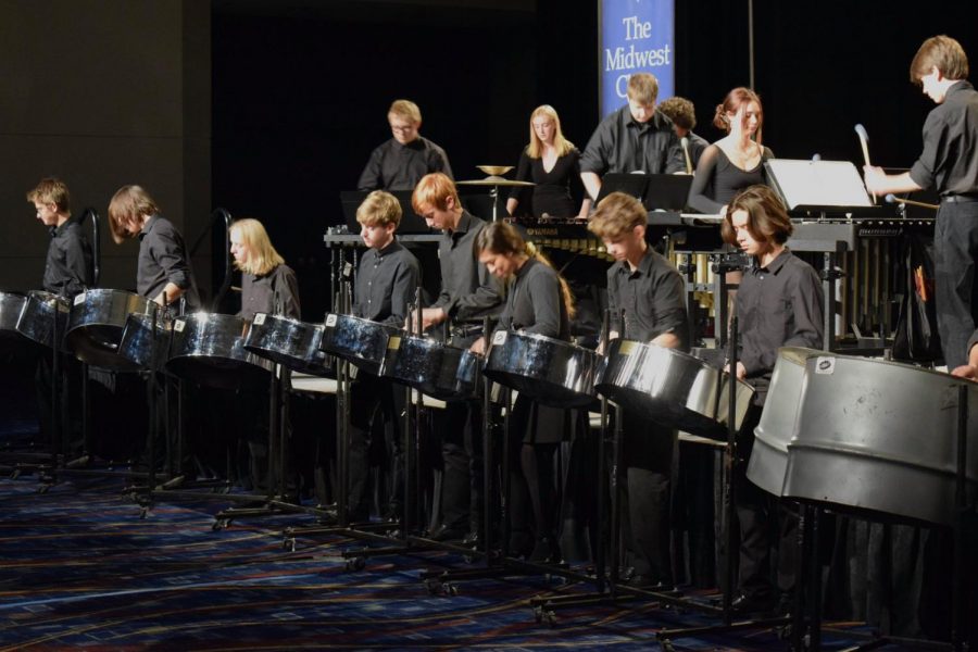 This wide shot of the entire Mac percussion section performing at the Midwest Clinic in Chicago gives you some idea of how hard it it to make out individual performances and even individual instruments with so many percussionists performing. Photo by Patrice Jones.