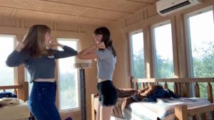 Griffin and New practice their elbow shake skills in their music video that simultaneously educates and entertains. Screenshot from video by Evelyn Griffin and Jewel New.