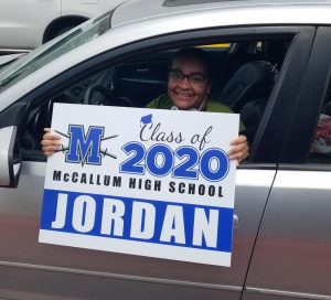 Jordan Bibby was among the seniors who picked up a yard sign during the curbside pickup on Friday. Bibby said she hopes the virtual graduation ceremony  gives her a sense of closure. “I feel like these past two months have blurred into one super long day with no real feeling of completion or moving toward a huge goal,” Bibby said. “It feels like nothing is real right now since I can’t see, feel, or experience [graduating], so maybe this will be the thing that makes graduation feel like a reality.”  Photo by Elaine Bohls-Graham.