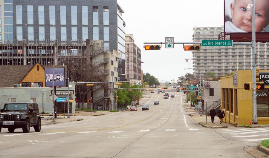 The decrease in transportation emissions has been a positive environmental impact as normally busy streets like Martin Luther King Jr. Boulevard just south of the UT campus have been virtually devoid of traffic. Photo by Henry Winter.