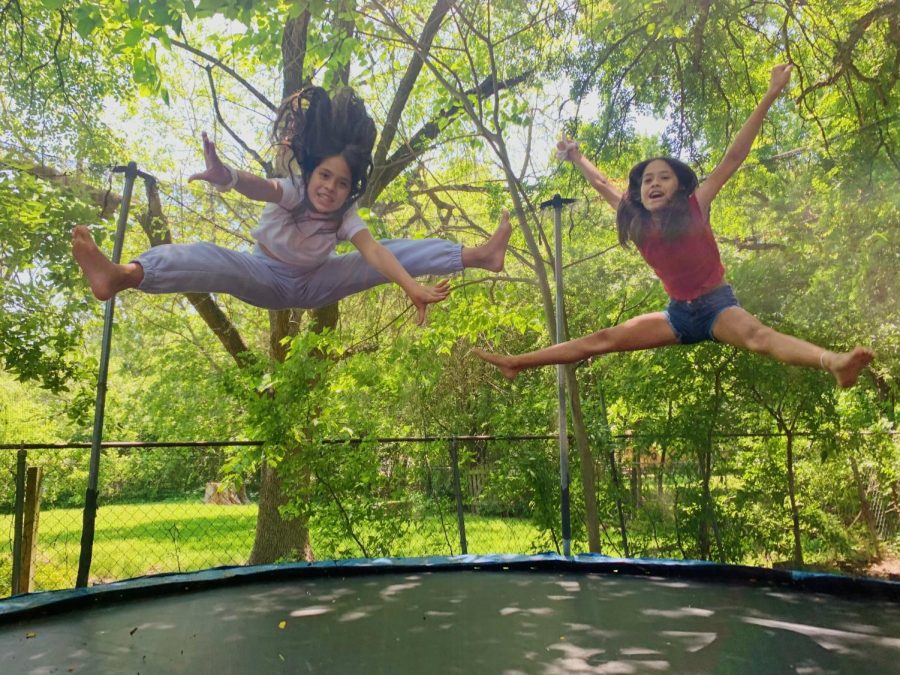 CHEER ON THE TRAMPOLINE: My little sisters are in cheer and their gym is closed so they spend a lot of time on the trampoline practicing their tricks. i often join them and they try and teach me their skills but then we give up and just play games. Photo by Ava Medina.