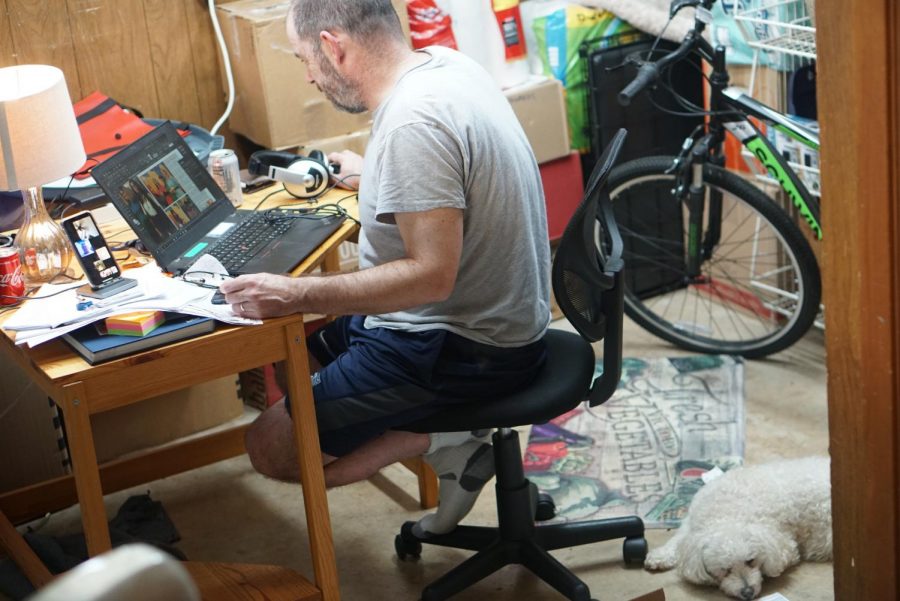 MAN AND DOG CAVE: During the first weeks of quarantines, I set up an office in the garage so that I could have room to spread out that wouldn't encroach on my wife's work space. It worked well until the temperatures started to rise, and the garage became an uncomfortable place to set up shop. With my wife inside the house and my office in the garage, our poor dog had to choose a companion, and she changed his mind frequently as if the pledge of his allegiance was troubling him. Photo by Annabel Winter.