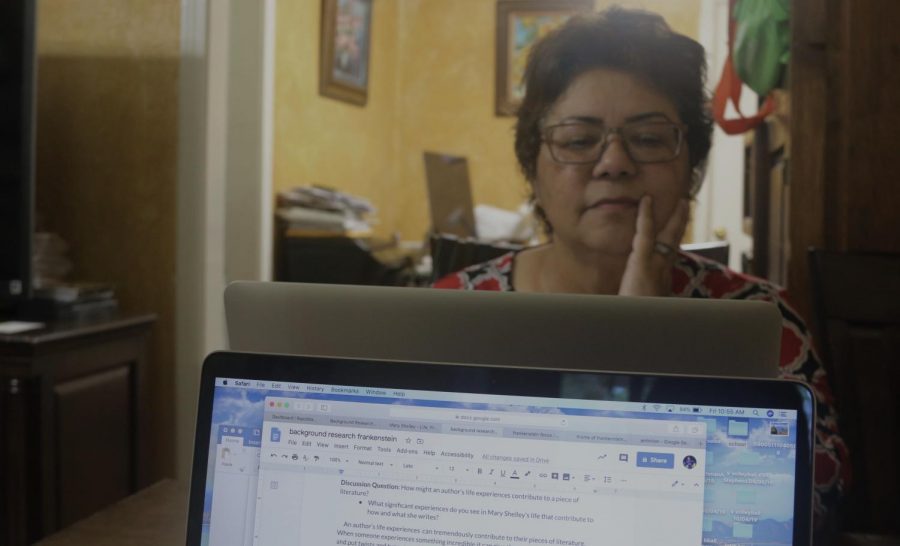 TWO COMPUTERS ROUND THE CLOCK: My mom stares at the computer bright in early in the morning as she looks at her email and I work on my online school assignment. The whole family has been on the computer 24/7 because its the only way we can get our work done! Photo by Sophia Dawson.