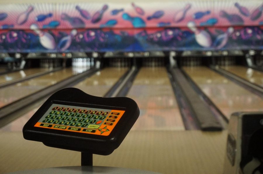 A control pad sits silhouetted against the lanes — a marker of the alley's old school charm. “Whenever I go to the Pflugerville bowling alley, it’s all modernized with touch screens and all that,” junior Olivia Linscomb said. “But at Dart Bowl you have the really old chairs, tables, the little control pads for screens, and it was great seeing the same faces every time.”