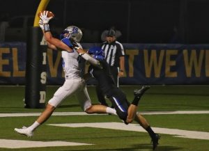 Sophomore J.D. Jordan catches his first varsity touchdown and Macs only trip to the end zone against the Anderson Trojans in the third quarter of the 19th annual Taco Shack Bowl.