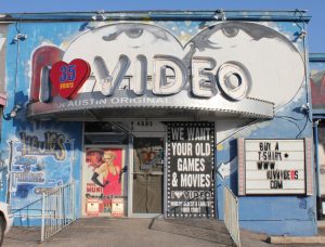 The I Luv Video storefront faces a nearly empty parking lot after closing down for business. The art-covered walls and colorful exterior reflect the friendly, creative atmosphere inside. While the store was open, staff were always ready to help customers find the films they wanted inside the oldest and largest video store in the world. Store owner Conrad Bejarano announced the abrupt closure on Sept. 1. 