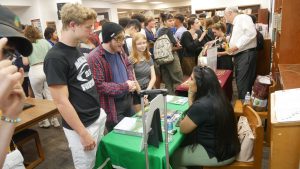 Juniors and seniors crammed into the library for a college fair on campus on Sept. 4, 2019. This is just one of the many college-application rites that have been fundamentally altered by the pandemic. Face-to-face counseling from admissions officers and even school counselors has become a thing of the past in 2020. Photo by Javier Vela.