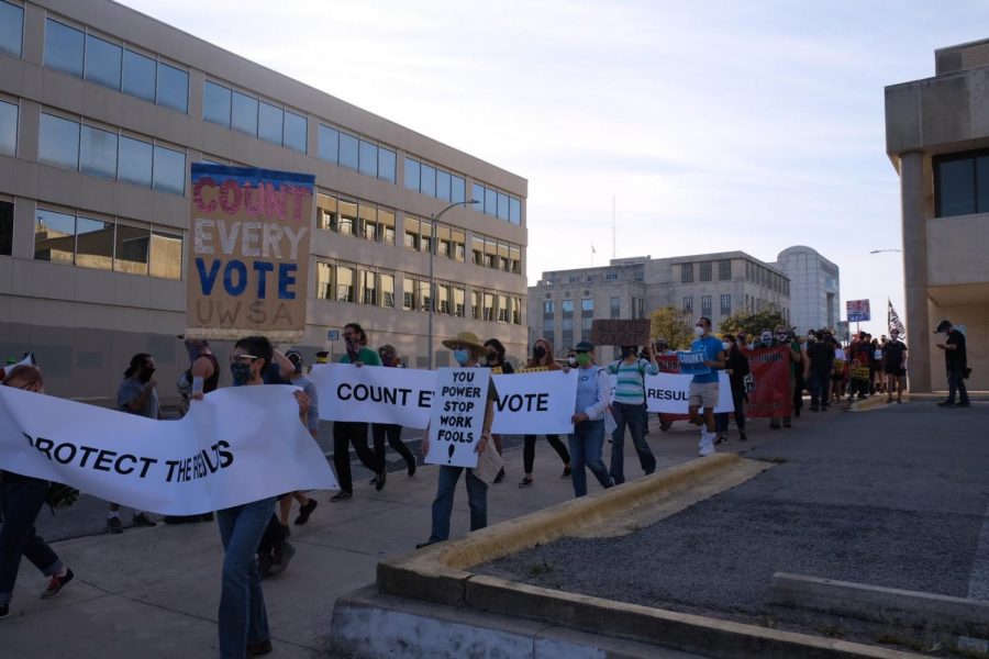As part of a demonstration that began at Woolridge Square and continued to the Texas Capitol, a hundred protestors gathered to insist that every ballot be counted in the 2020 election after the president argued that elections officials should stop counting ballots after Election Day. 