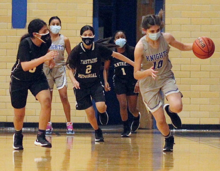 In her first high school basketball game, freshman Esme Barraz recorded seven steals and scored 11 points to help lead the varsity to an easy victory over Eastside Memorial.