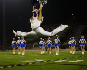 Senior Blue Brigade co-captain Matthew Vargas leaps during the Dec. 11 halftime show, a field pom dance to Edge of Glory. The game turned out to be the end of the Knights season, and the last time the Blue Brigade seniors would perform at halftime of a high school football game. “I was really excited and optimistic,” Vargas said of his feelings before Fridays game. “The sunset was so pretty and it just set the mood and I was happy.” By halftime, the Knights trailed by 21 points and the future looked bleak for the season, but Blue Brigade was still excited for its performance. “I knew it would be the last performance, so I just wanted to give it my all, and honestly I have never felt so happy during a performance. Hitting that ending pose gave me the chills, and I had such a big smile under my mask.”