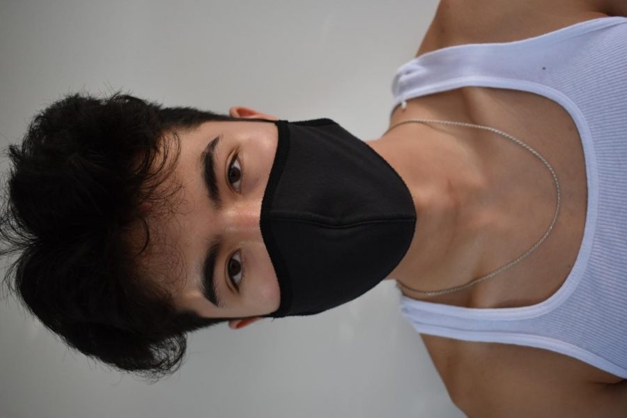 Sophomore Azra Kleiman and  Mac alumni Rey Bernacki pose for a picture in their masks. "masks are a pivotal way of stopping the virus, " Bernacki says.