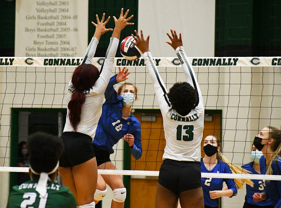 GELLA, YES! Freshman middle hitter Gella Andrew spikes the ball into the Cougar block for one of her six kills during the second set of the Knights’ 3-1 bi-disrict playoff loss on Friday night. The Knights lost the set, 25-23, in heart-breaking fashion to fall behind, 2-0. The Knights rebounded to win the third set, 25-17, beforing losing the fourth set, 25-20, and the match, 3-1. Andrew was solid in the middle in the final game of her breakout freshman season. Her kill percentage was a team best 37.5 percent, and she had one of the Knights’ four solo blocks for the match. 