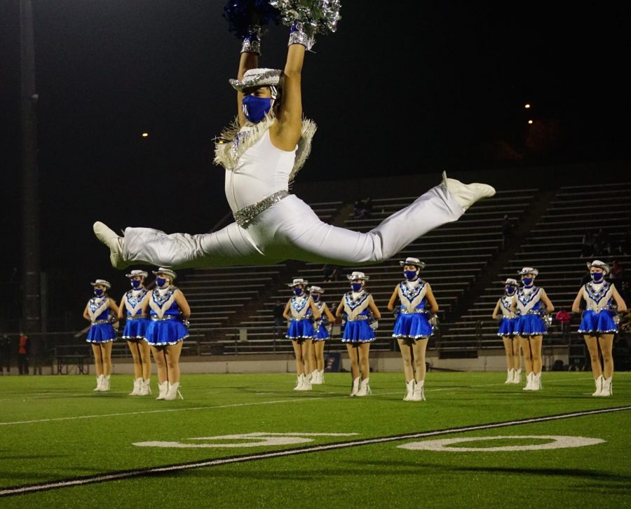 Senior Blue Brigade co-captain Matthew Vargas leaps during the Dec. 11 halftime show, a field pom dance to “Edge of Glory.” The game turned out to be the end of the Knights’ season, and the last time the Blue Brigade seniors would perform at halftime of a high school football game. “I was really excited and optimistic,” Vargas said of his feelings before Friday’s game. “The sunset was so pretty and it just set the mood and I was happy.” By halftime, the Knights’ trailed by 21 points and the future looked bleak for the season, but Blue Brigade was still excited for its performance. “I knew it would be the last performance, so I just wanted to give it my all, and honestly I have never felt so happy during a performance. Hitting that ending pose gave me the chills, and I had such a big smile under my mask.”