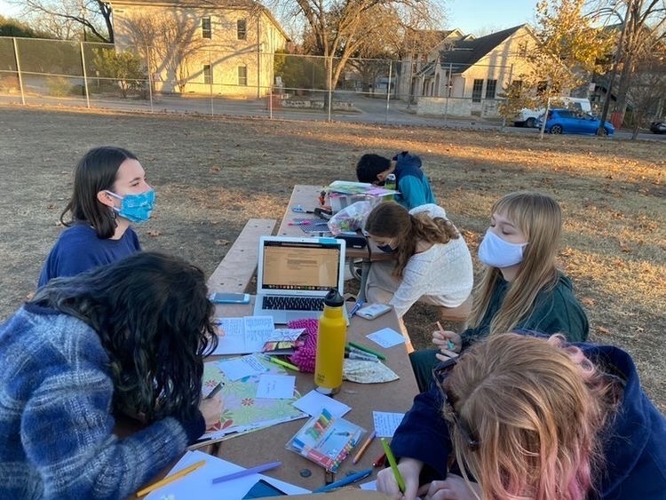 The Austin Climate Coalition meets outside to assemble packages for Project Wildflower on Feb. 17 2021. 
