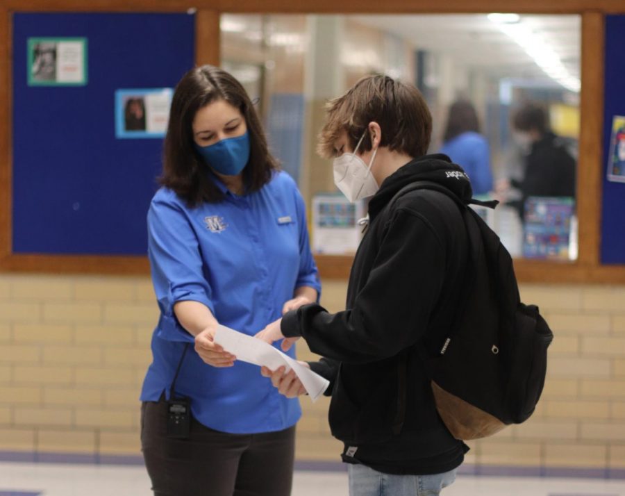 McCallum Interim Principal Nicole Griffith helps a first-day freshman on March 1, which felt like one of Griffiths many first days back that she has experienced as the McCallum principal during a pandemic.