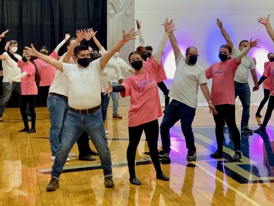 DADS CAN DANCE IF THEY WANT TO: Senior co-captain Addie Seckar-Martinez and junior lieutenant Annabel Winter dance alongside their teacher fathers, art teacher Jeff Seckar-Martinez and journalism teacher Dave Winter in the spring show parents dance on Friday night. “I am so thankful that my dad agreed to do the dads dance with me because it’s nice to just be goofy and silly with him and not worry about making the routine perfect.” Addie said. “I will miss having opportunities like that next year, but I know I’ll enjoy watching him dance with my younger sister.” While the Blue Brigade girls had more dance experience, the dads brought something very important to the table: a sense of humor. “My goal heading into the dance was not to be that dad that caused the shrieks of laughter for falling or knocking a row of dancers down, but Harper and Emily did a great job of choreographing the dance, and Annabel was a skilled and patient teacher,” Dave Winter said. “Once I actually got on stage, it was slightly more fun than it was terrifying.” Reporting by Grace Nugent.