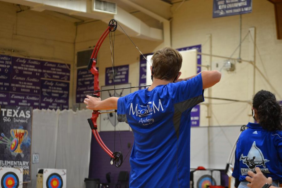 FROM THE BEGINNING: Freshman Milo Conner (shown here) and freshman Sophie Leung-Lieu are the only two archers in Coach DeLine’s program to competitively shoot in teams from three schools. In 2017, they shot at Highland Park; from 2018-2020. at Lamar; and now, they are shooting as part of the McCallum team. “It’s a great community with lots of support from our coach,” Conner said, adding that he plans to continue archery during his three remaining years of high school. Reporting by Leung-Lieu.