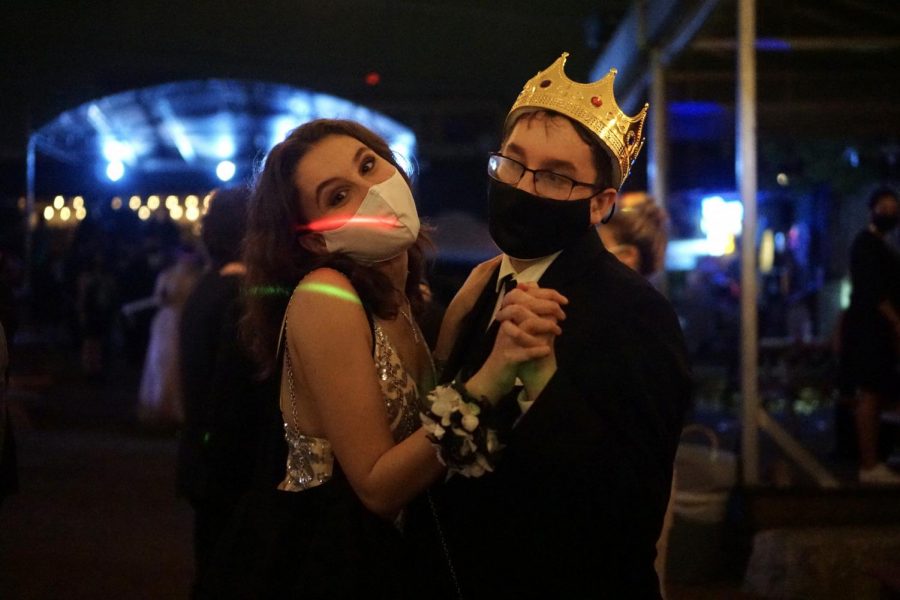 LIVING LIKE A KING: Senior Amelie Chaouat smiles as she shares a dance with Kyle Davis, who was voted as one of this year’s Mac prom royalty. For Davis, the royal victory came as a complete surprise. “I thought it was cute and all that I made it to the second round of voting,” he said, “but I had no idea that I would win. I was beyond excited, and I’m so thankful to have been chosen.” As for the rest of the night, Kyle spent his time dancing with friends and reconnecting with classmates he hadn’t seen due to COVID. “I was honestly very worried that prom was just going to be awkward for so many people because so many of us haven’t had actual social interactions in big groups, but it was definitely the opposite,” Davis said. “It was full of interaction and everyone was very talkative.” Most of all, Davis is grateful that he and his peers had the opportunity to celebrate the end of senior year. “It was actually super reassuring,” he said. “Being able to even have a prom in general was amazing, and the fact that we got to have at least one event for the class of 2021 was just lovely.” Reporting by Madelynn Niles.