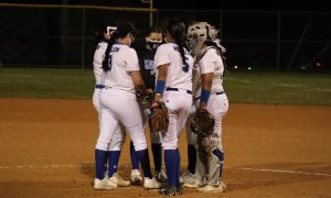 The varsity infield meets at the mound during the Knights loss to Anderson on March 2. Despite the challenges of the pandemic, the Knights earned a 5A state playoff spot by finishing fourth behind Lockhart, Anderson and LASA.
