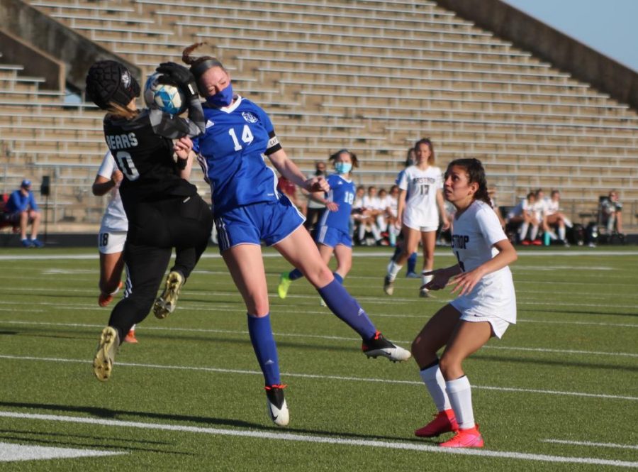 Senior Avery Miller attempts a header in  the Bi-district playoffs against Bastrop High School on March 26. Photo by David Winter. 