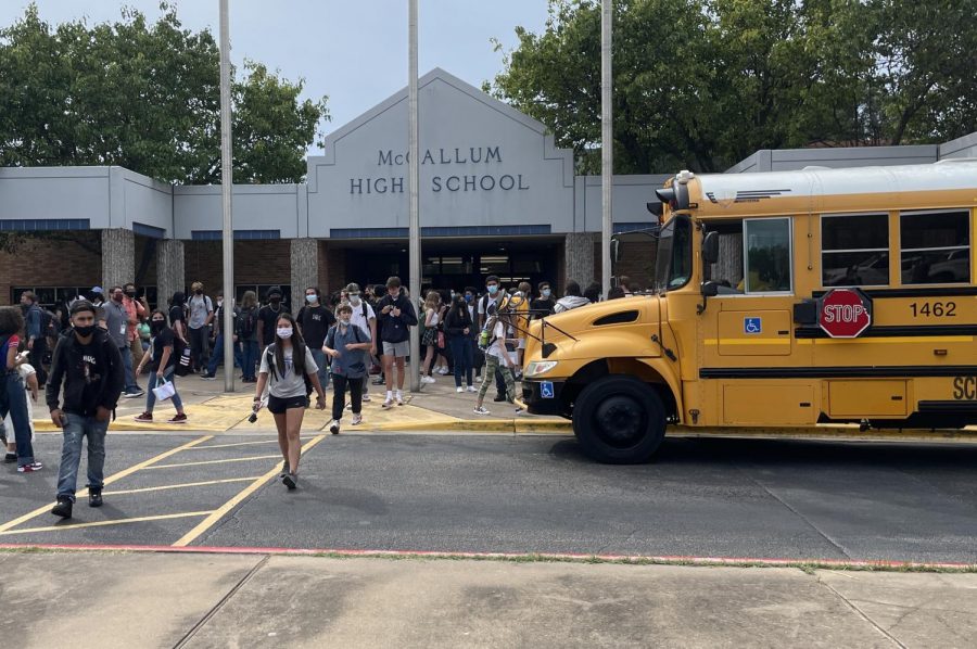 DAY+ONE+DOWN%3A+McCallum+students+exit+campus+after+the+school+bell+rang+at+4%3A35+on+Tuesday+Aug.+17%2C+marking+the+end+of+the+first+day+of+entirely+on-campus+school+since+the+beginning+of+the+pandemic.+For+some%2C+the+transition+from+virtual+school+was+difficult+because+it+posed+different+challenges+for+students.+%E2%80%9CThe+first+day+of+school+was+exhausting+because+I+havent+been+around+that+many+people+in+so+long%2C%E2%80%9D+Sophomore+Naomi+Pearson+said.+%E2%80%9CI+think+I+hit+my+limit+of+people+at+the+beginning+of+second+period.+I+think+it+will+take+a+lot+of+adjusting.%E2%80%9D+Photo+and+reporting+by+Alice+Scott.