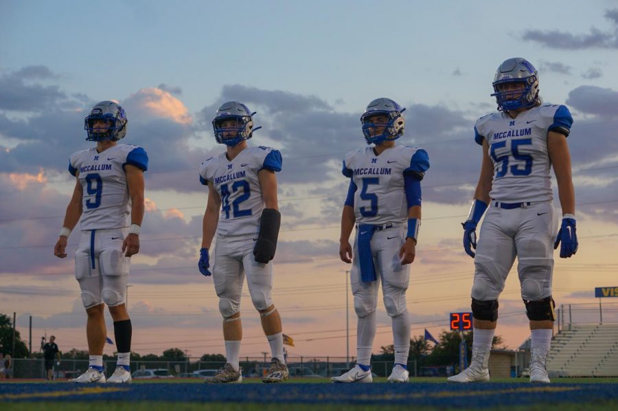 CAPTAINS AT TWILIGHT: Seniors Ez Guenther, Jake Hissey, Jaxon Rosales and Johan Holmes lineup for the coin toss before their last non-district game against the Kerrville Tivy Antlers. For Hissey, it was his first game back after suffering a wrist injury before the team’s marquee matchup against the Anderson Trojans. Despite wearing a cast that prompted the opposing coaches to urge their offensive skill players to run at "the one-armed safety," Hissey held his own, nearly making an interception to seal the victory on the play before Guenther succeeded in doing the same. The Knights went on to beat Tivy 23-15 in a game that despite Tivy’s 0-4 record, they were not favored to win. Caption by Thomas Melina Raab.