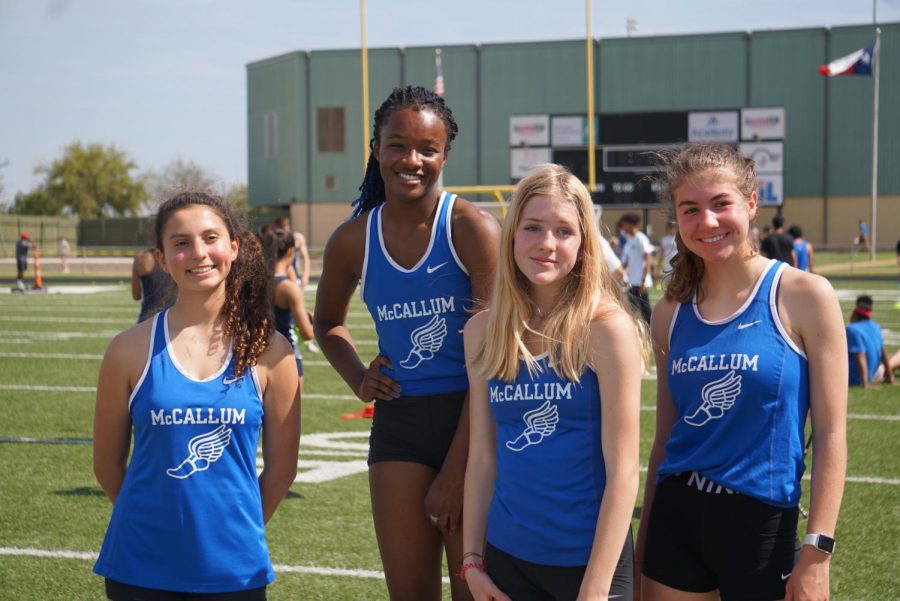At+the+Austin+Relays+at+Burger+Stadium+on+March+12%2C+2020%2C+one+day+before+COVID-19+was+first+detected+in+Austin%2C+Kendall+Shenoda%2C+Caytie+Brown%2C+Stella+Davidson%2C+and+Zoe+Tanner+relax+between+their+scheduled+events.+Tanner+launched+a+petition+drive+to+create+a+track+class+at+Mac.+In+addition+to+making+the+sport+safer+and+more+competitive%2C+Tanner+believes+it+will+improve+an+already+strong+sense+of+community+among+the+athletes+on+the+team.