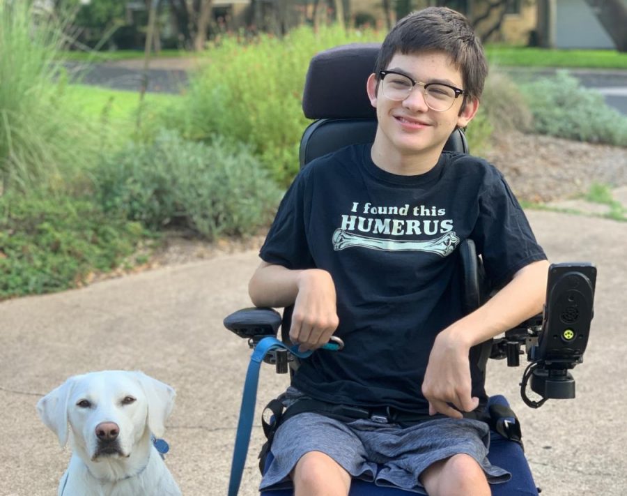 Freshman Ben Polega poses with his service dog Friday for a first-day-of-school photo.