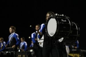 Freshman Jake Stagg-Ricketts plays bass drum at the Capital City Marching Festival.on Sept. 25
at Burger Stadium. 
Photo by Morgan Eye. 