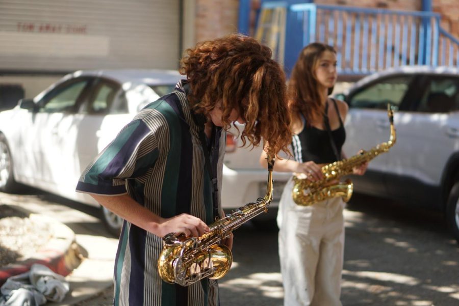 Junior Nico Martinez rehearses with the other marching band saxophonists on Sept. 16. Martinez believes the overall talent of the band pushes him to work hard. “Everyone is so good, and there’s so much interest in band,” he said.